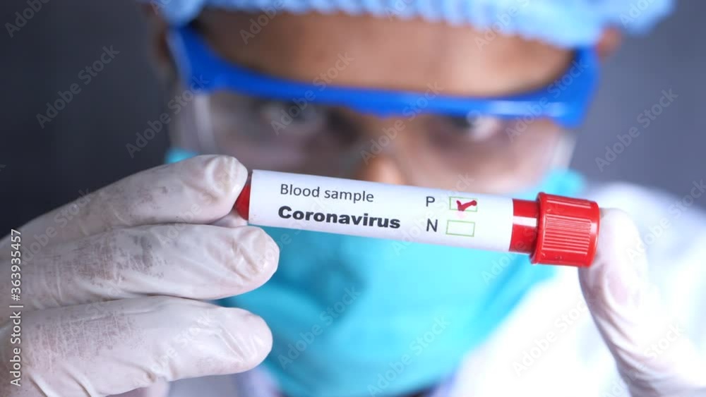 laboratory technician hand holding blood test tube laboratory technician hand holding blood test tube