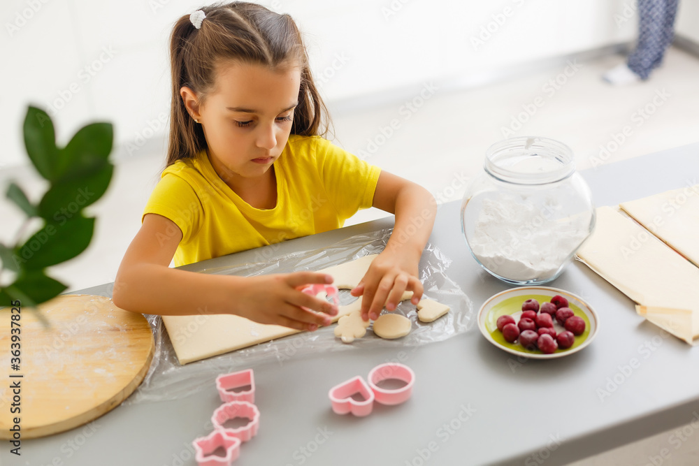 Little girl make cookies at the advent time. Little girl make cookies at the advent time.