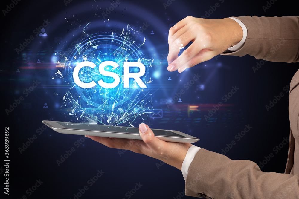 Close-up of a touchscreen with CSR abbreviation, modern technology concept Close-up of a touchscreen with CSR abbreviation, modern technology concept