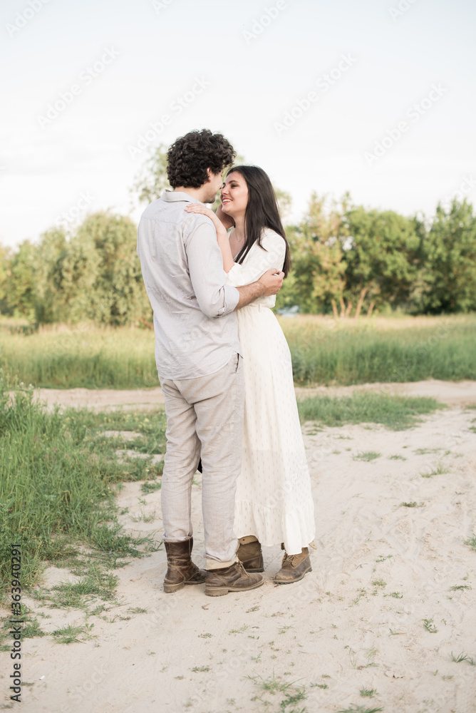 Naklejka premium Young man gently kissing girlfriends head. Soft selective focus.