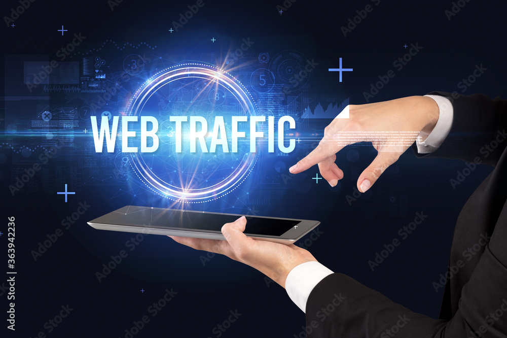 Close-up of a touchscreen with WEB TRAFFIC inscription, new technology concept Close-up of a touchscreen with WEB TRAFFIC inscription, new technology concept