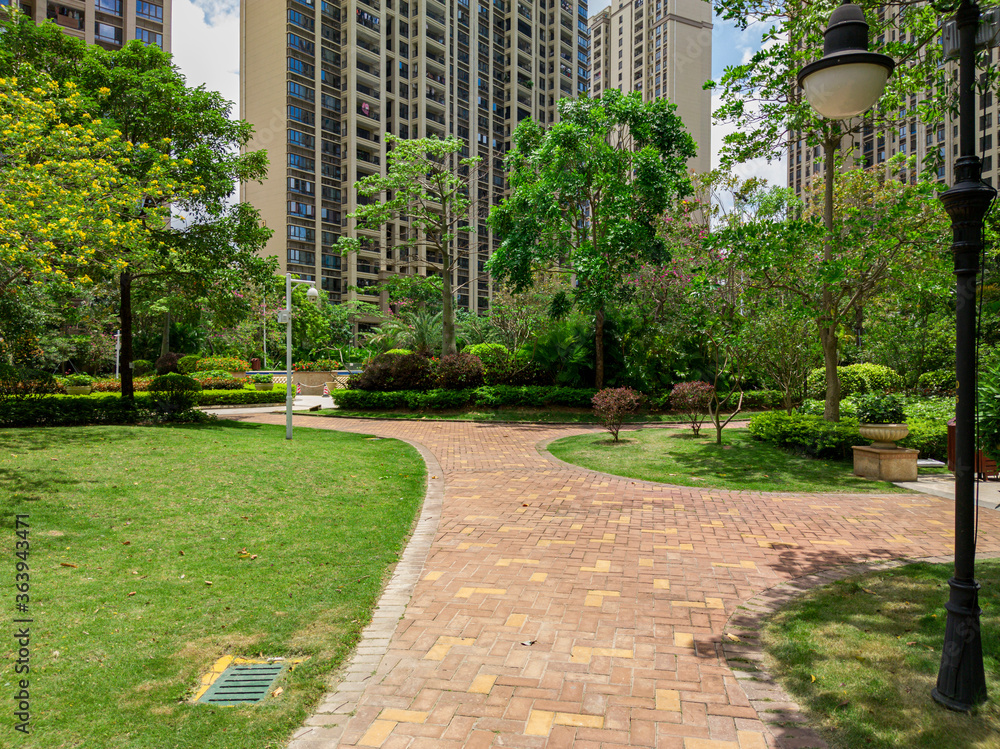Recreational grass and sidewalks in a residential park Recreational grass and sidewalks in a residential park