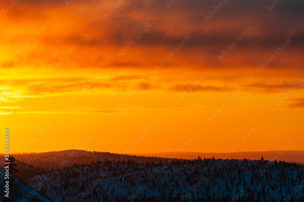 Sunrise at mountain landscape in winter