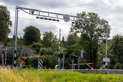 Railroad crossing in the suburbs. Summer. Day.