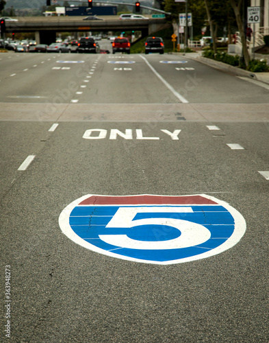 Sign for the interstate 5 freeway painted on the pavement shot from the driver’s perspective © F Armstrong Photo