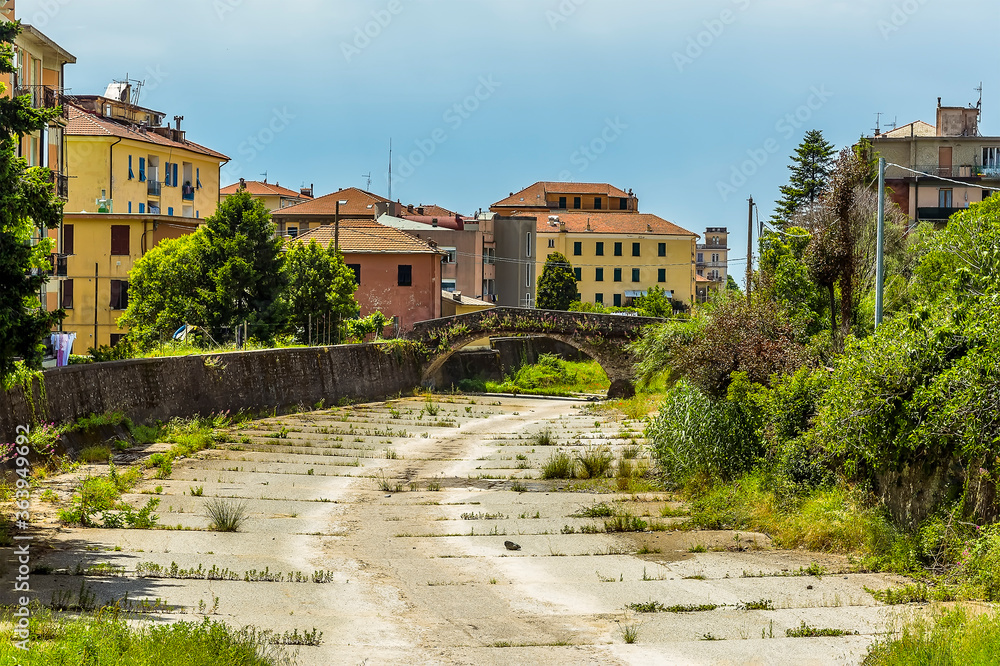 A view down the flood channel in the village of Levanto, Italy in the summertime