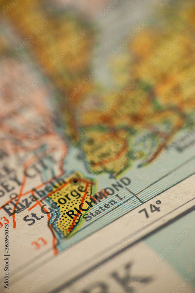 Naklejka premium WOODBRIDGE, NEW JERSEY - October 16, 2018: Richmond, Staten Island, is in focus on a vintage map.