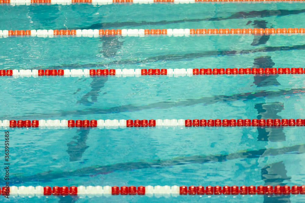 Red and white swim lane lines in a crisp pool Stock Photo Adobe Stock
