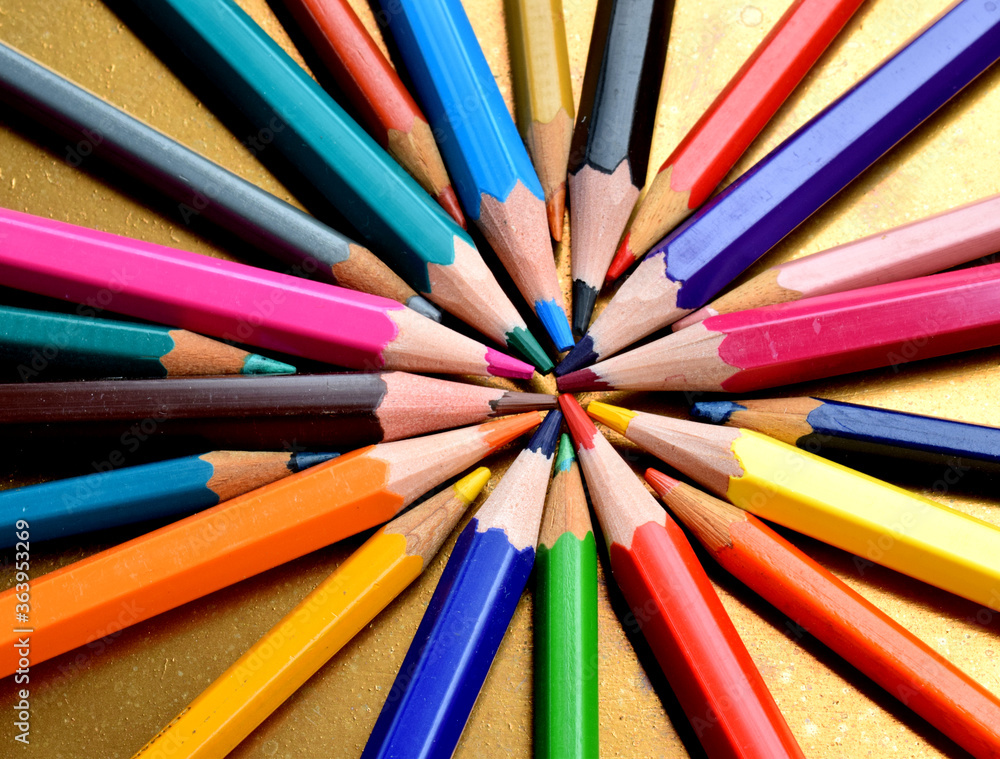 Fototapeta premium colored pencils isolated on golden background