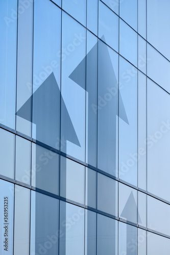 The concept of business growth and personal success. Shooters on the facade of the building.