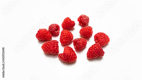 red raspberries in a white background