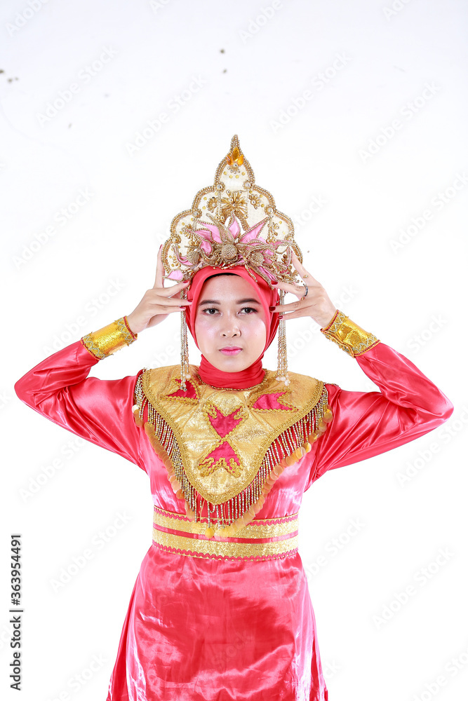 Beautiful smiling Asian girl wearing a set of modern traditional clothes, the traditional female outfits originated from Indonesia. Indonesian Women