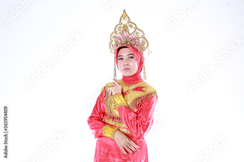 Beautiful smiling Asian girl wearing a set of modern traditional clothes, the traditional female outfits originated from Indonesia. Indonesian Women