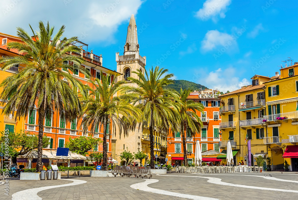 The church and colourful buildings stand proud in the central square in Lerici, Italy in the summertime
