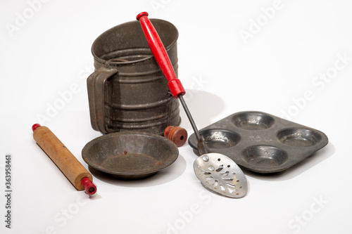 Vintage children's toy bake set isolated on a white background