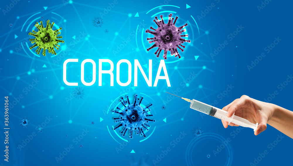 Syringe, medical injection in hand with CORONA inscription, coronavirus vaccine concept