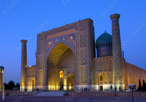 Sher-Dor Madrasah on Square Registan, the inscription above the gate in a special Arabic script it says "Lord Almighty!" . Samarkand. Uzbekistan..