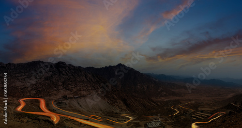 Al Hada Mountains near Taif, dangerous Al Hada road mountain pass with night  time head light trails, in western Saudi Arabia photo