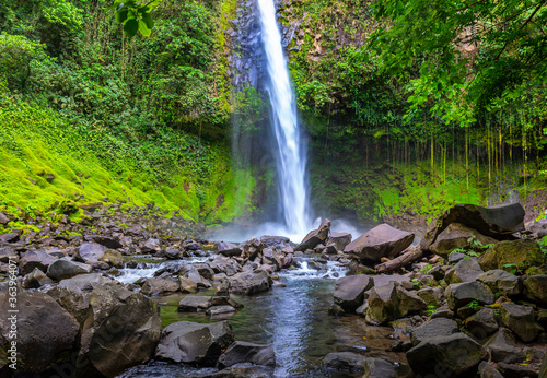 La Fortuna Waterfall in the forest with river  close to Arenal Volcano  Costa Rica national park. Central America.
