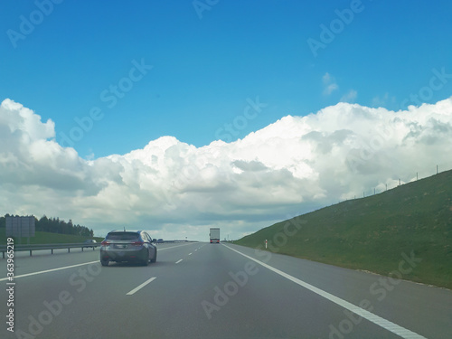 Clouds On Blue Sky Over Asphalt Road © daily_creativity