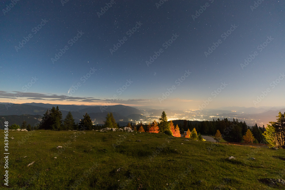 Fototapeta premium Comet NEOWISE from Dobratsch with View To Villach Carinthia Austria By Night