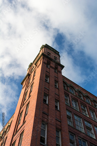 Tall old factory mill building