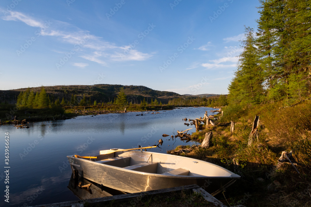 Grands-Jardins national park, Canada - June 2020: View of a bark anchored in a lake, in Charlevoix, Canada