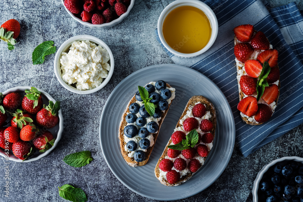 Fresh breakfast with Blueberry, Strawberry and raspberry ricotta rye sandwiches Fresh breakfast with Blueberry, Strawberry and raspberry ricotta rye sandwiches