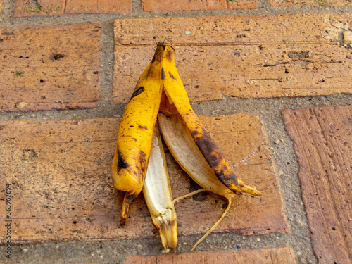 ripe banana peel on the ground. danger of slipping. photo