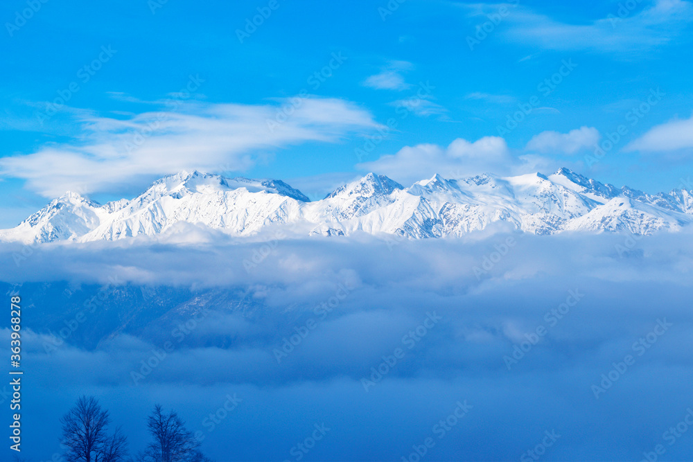 Winter landscape of mountains and white clouds
