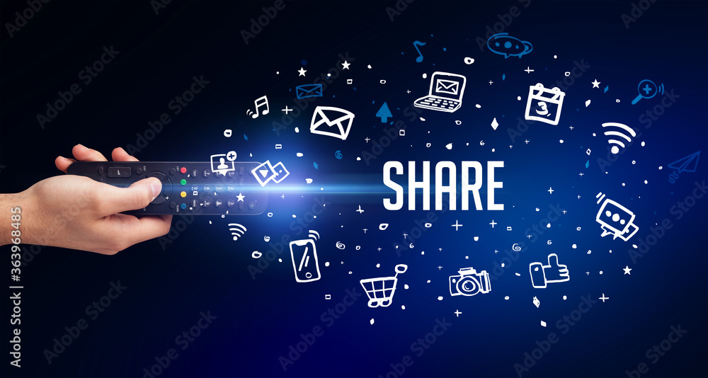 hand holding wireless peripheral with SHARE inscription, social media concept hand holding wireless peripheral with SHARE inscription, social media concept