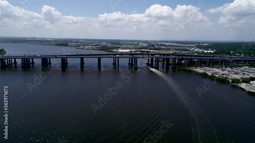 Aerial view of boat on the Raritan River Heading towards the Edison and Driscoll Bridge near Sayreville, NJ photo