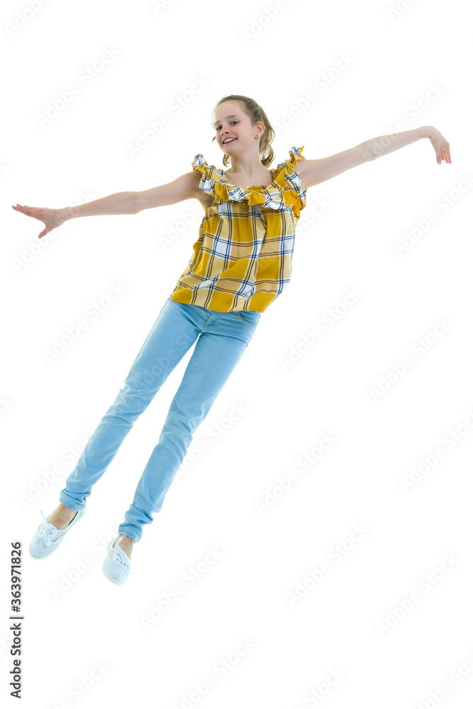 Little girl is jumping.The concept of a happy childhood, outdoor Little girl is jumping.The concept of a happy childhood, outdoor