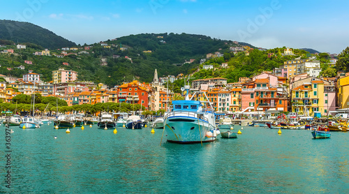 Boats moored in the bay in front of the town at Lerici, Italy in the summertime