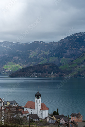 Lake in the mountains of Switzerland with reflections and calm water