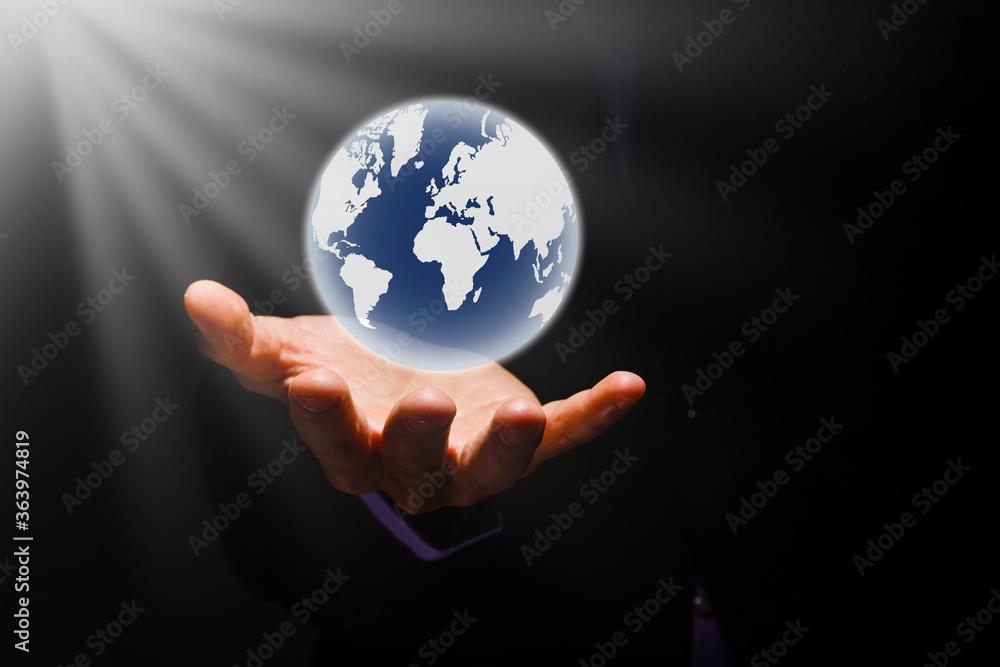 holding a glowing earth globe in his hands holding a glowing earth globe in his hands