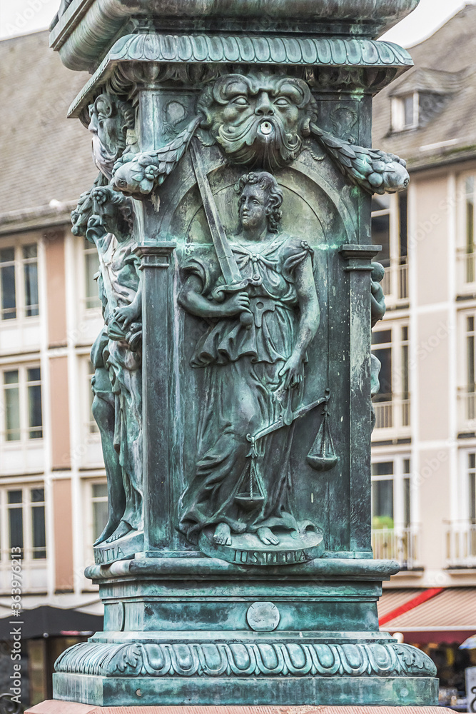 Statue of Lady Justice in front of the Romer at Romerberg (Romerplatz) in Frankfurt am Main, Germany.