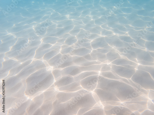 Fototapeta Naklejka Na Ścianę i Meble -  Underwater still of the water waves reflection on white sand in the Mediterranean Sea