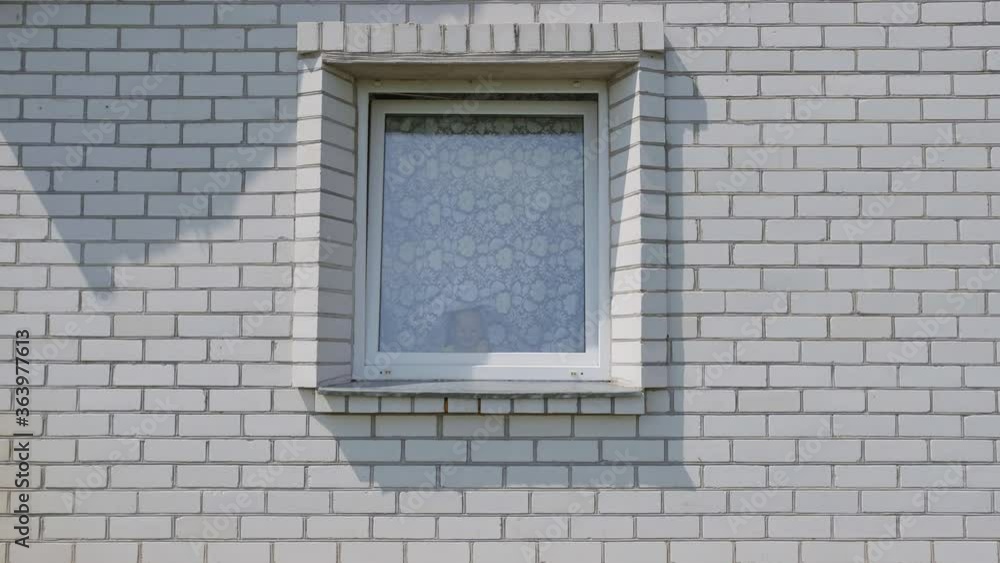 Quarantine concept. Big family in the window of their house. Quarantine concept. Big family in the window of their house.