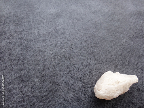 white rock on textured background
