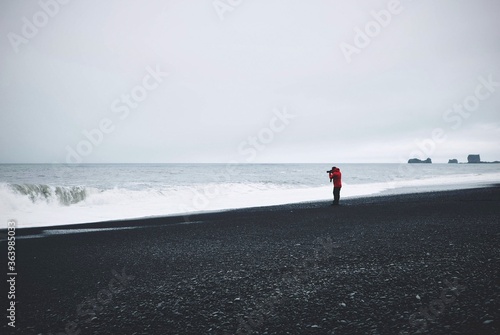 man walking on the beach