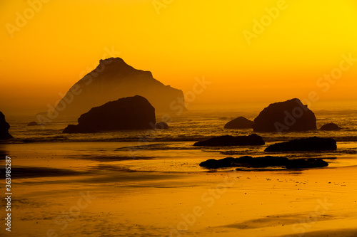 Face Rock and other sea stacks at sunset on the southern Oregon coast at Bandon