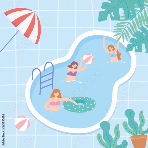 young people on vacation in the pool playing and swimming