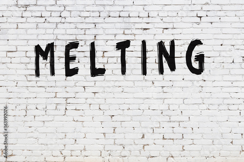 Photography Inscription melting painted on white brick wall