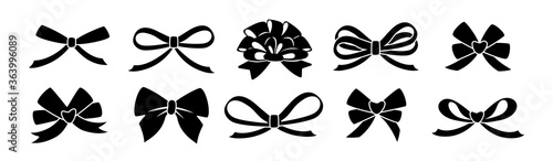 Ribbon bow black glyph set. Valentine day or wedding decorated tape bows. Cartoon silhouette elements for present, celebration and congratulation. Isolated on white background vector illustration