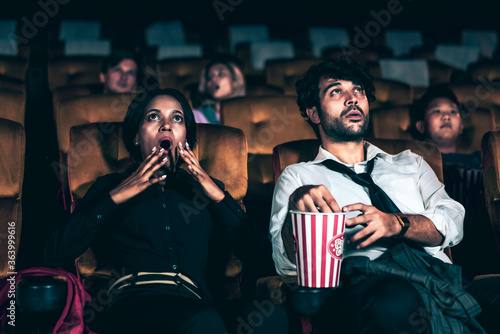 Quadro su tela Audience sitting in a cinema and watching terrible horror