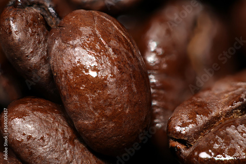 Brown coffee beans, closeup macro for background and texture.