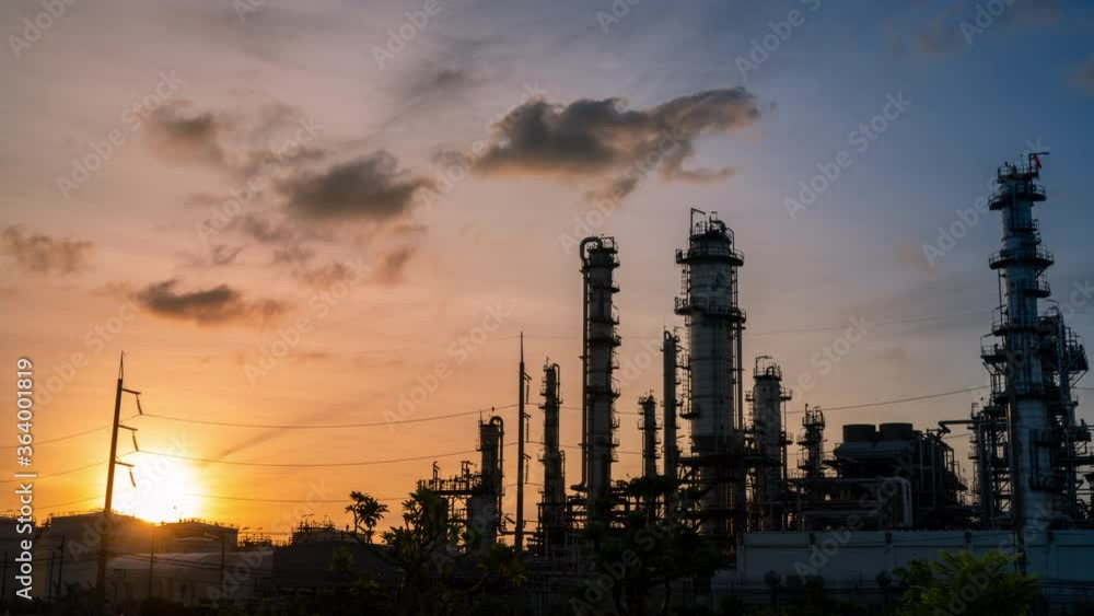 time lapse at sun rise on chemical oil refinery plant, power plant and metal pipe on sunrise sky background. time lapse at sun rise on chemical oil refinery plant, power plant and metal pipe on sunrise sky background.