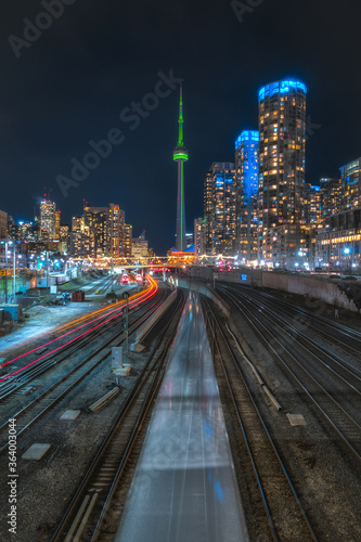Toronto Cityscape Skyline at Night with train and busy city skyscrapers