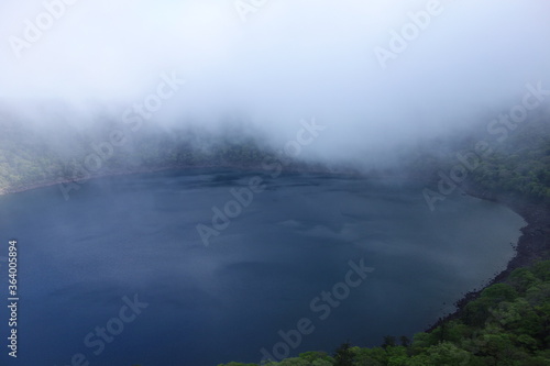Onami-lake(old crater) covering fog in Kirishima mountain range in the early morning, Miyazaki, Japan © 01